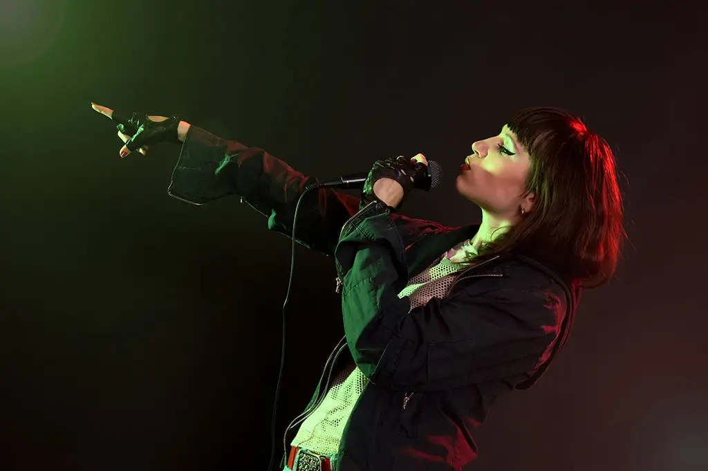 A woman singing on stage