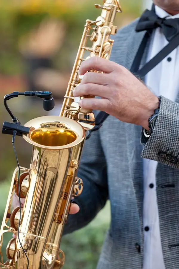 Close-up of an alto saxophone beside a clip-on microphone