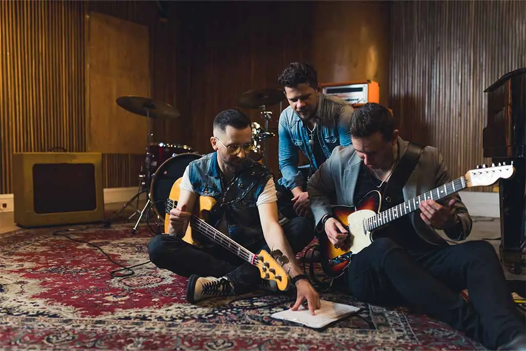 Band mates composing a song