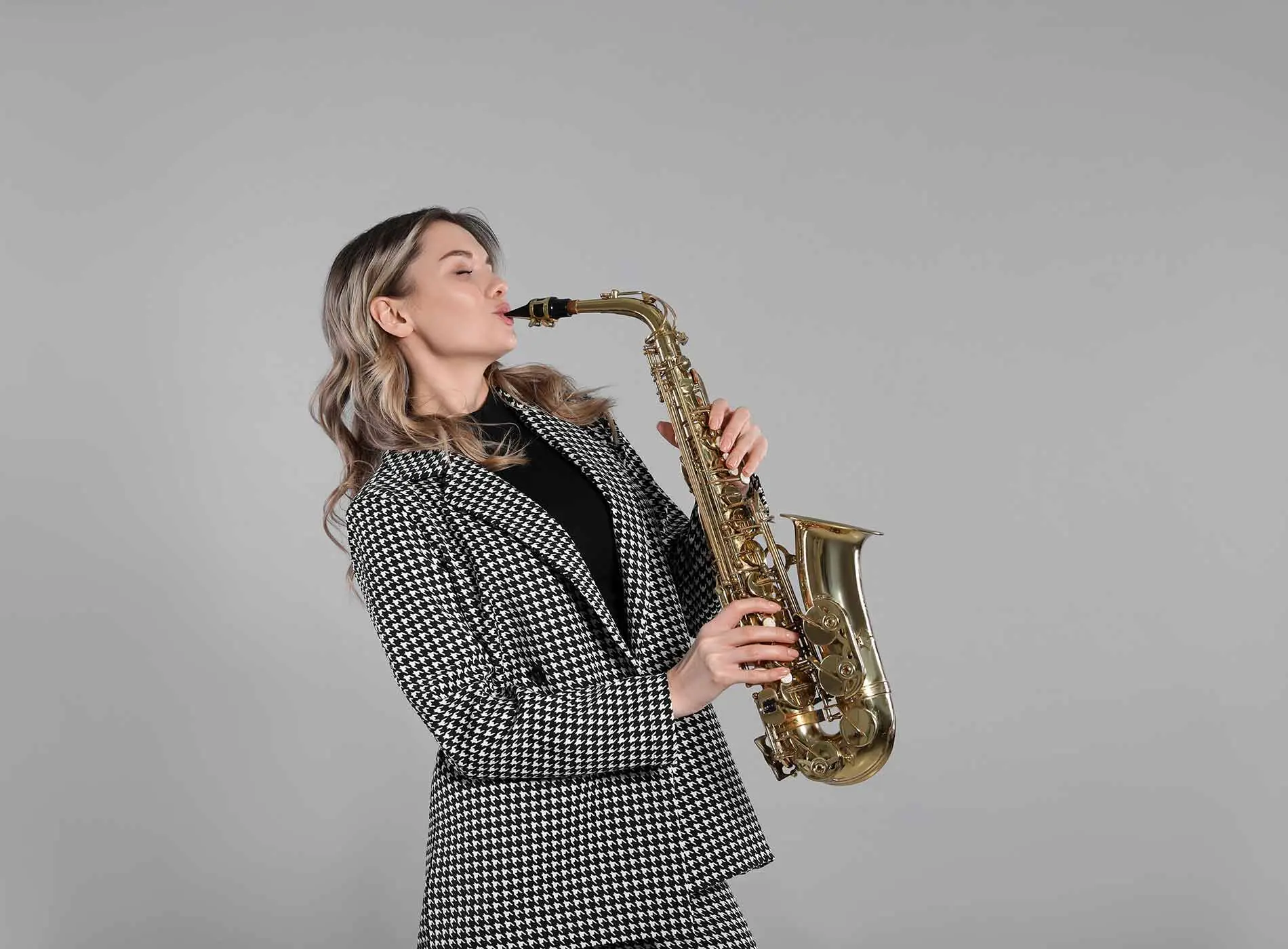 Beautiful lady playing saxophone