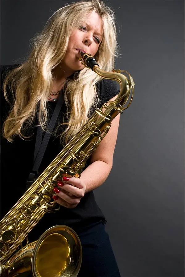 Blonde&nbsp;woman playing saxophone