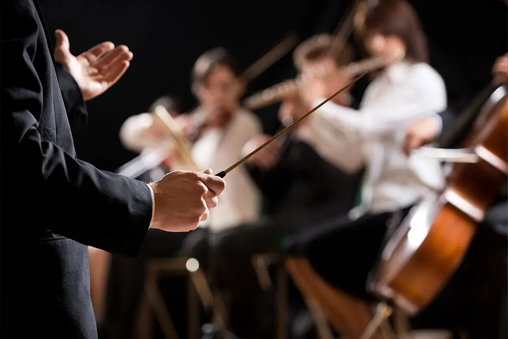 Conductor conducting orchestra