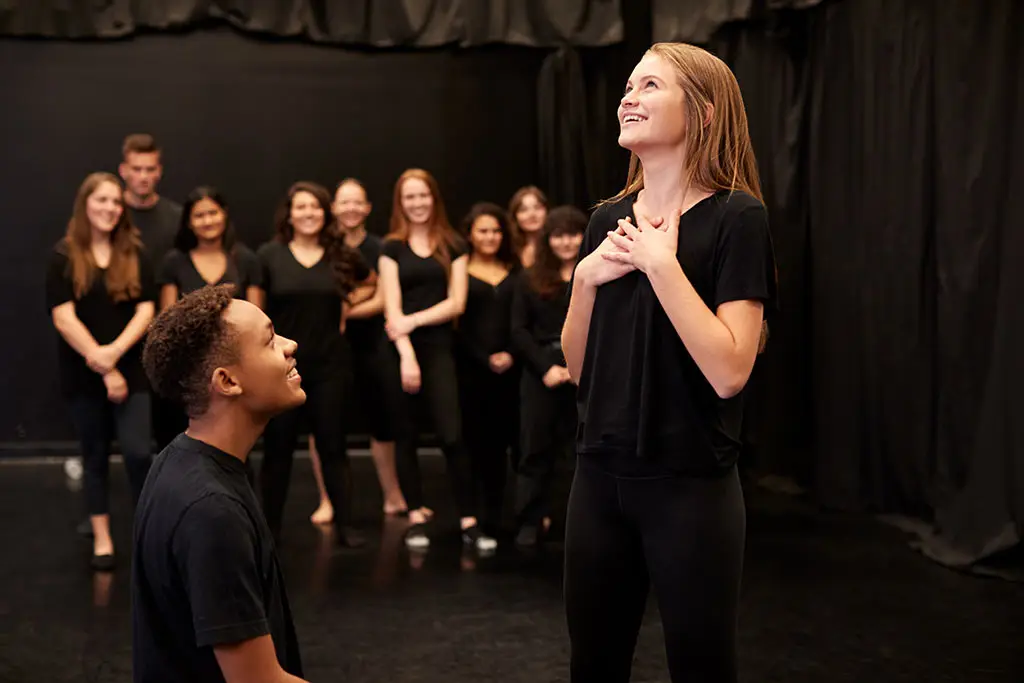 Image of drama students practising at performing arts school