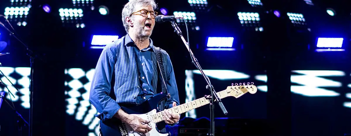 Eric Clapton singing whilst playing the guitar