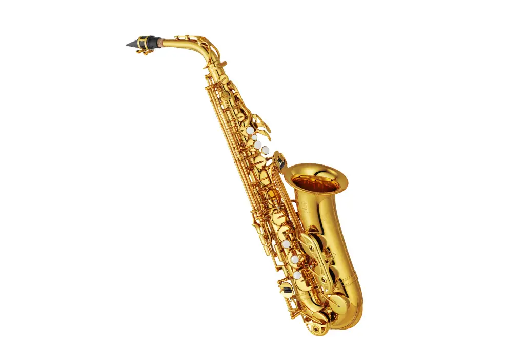 Gold alto saxophone on a white background