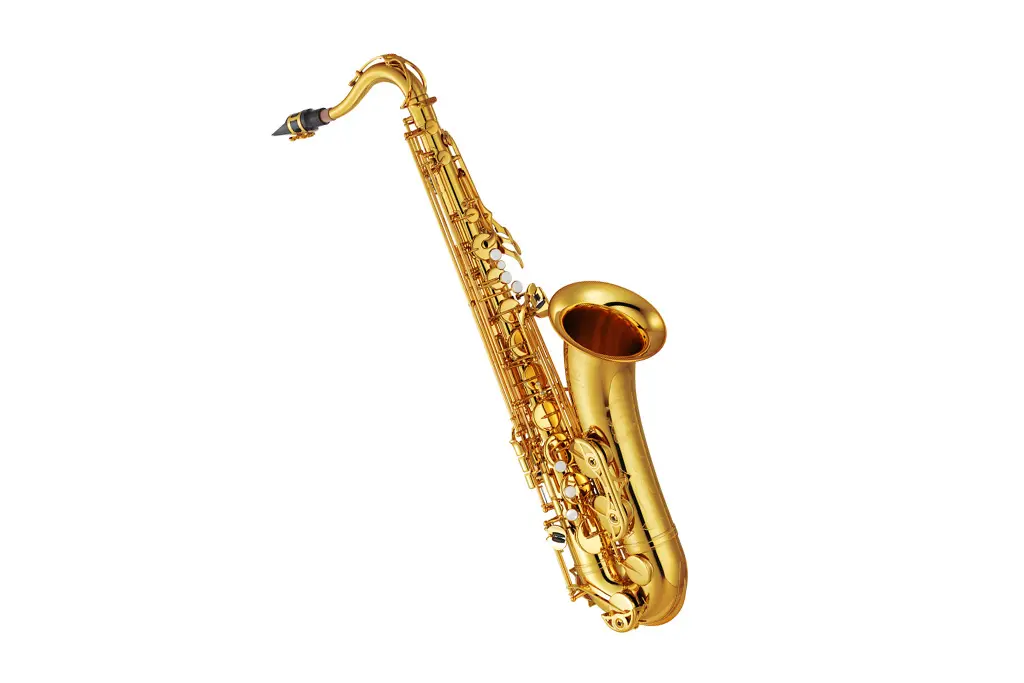 Gold tenor saxophone on a white background