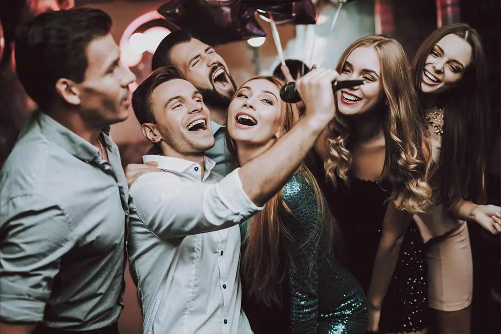 Group of people singing along