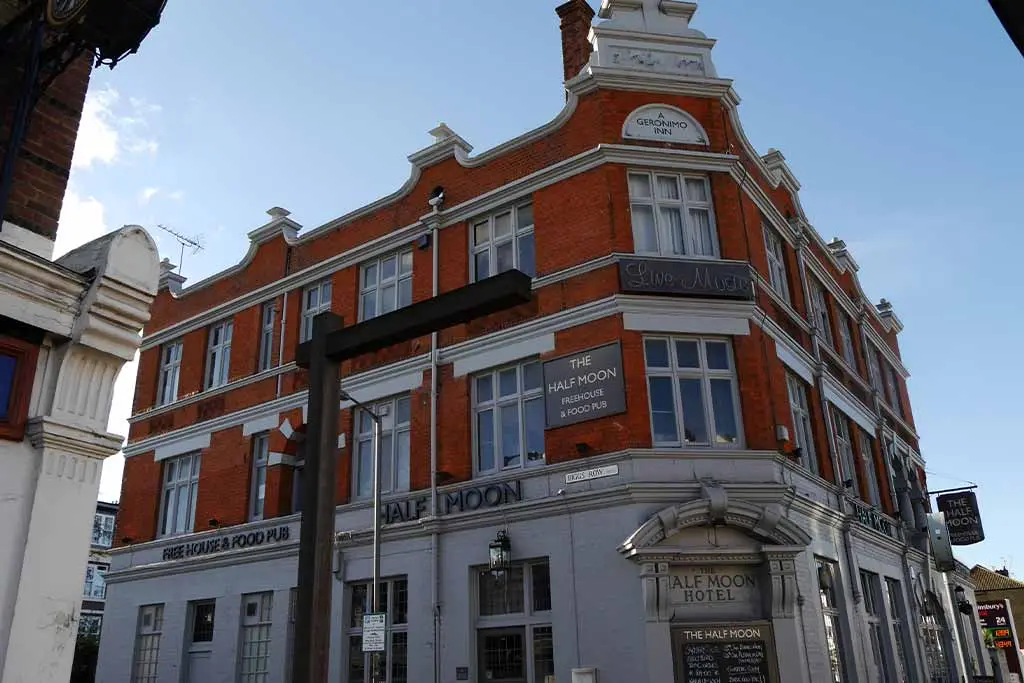 The Half Moon pub exterior on a street corner