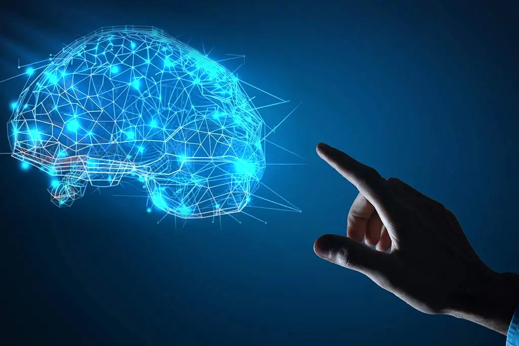 Hand pointing towards a glowing digital brain graphic