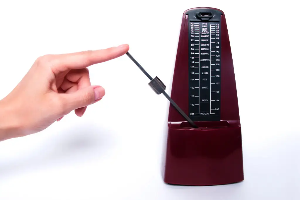 Hand pointing at the metronome