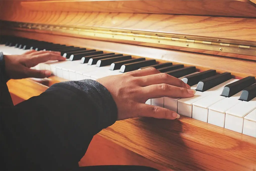 Hands playing piano