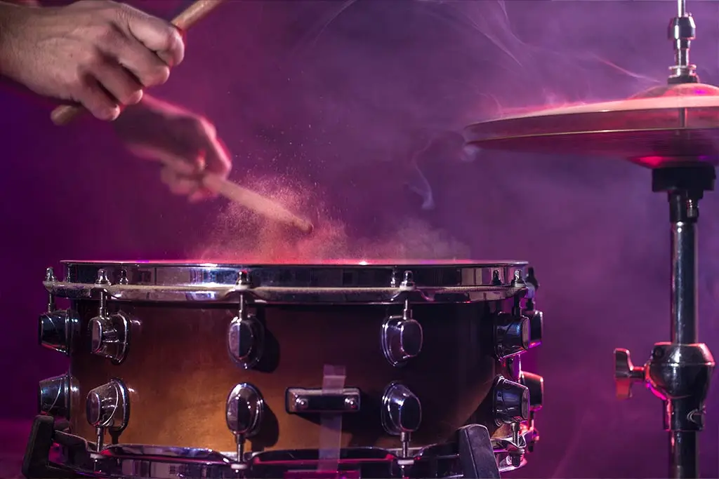 Hands playing the snare drum