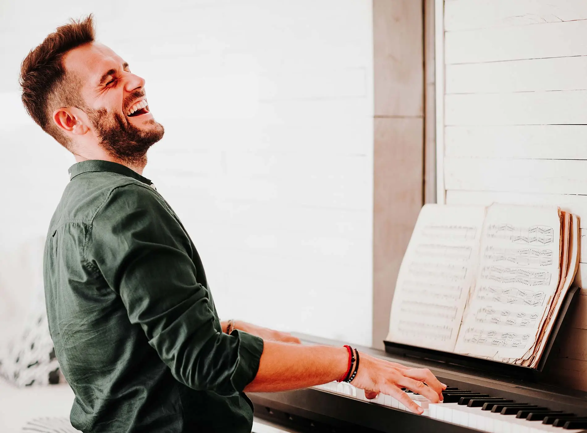 Happy man playing the piano