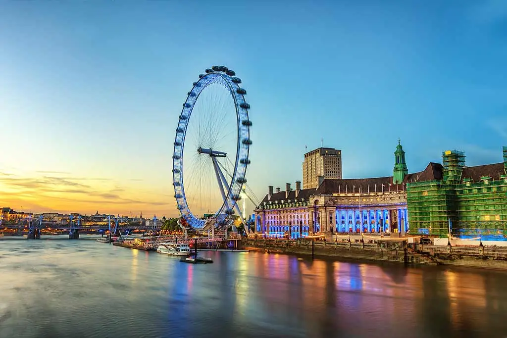 London Eye beside the River Thames at dusk