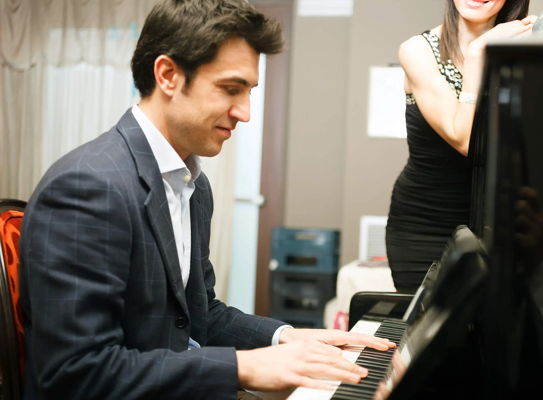 Man learning to play the piano