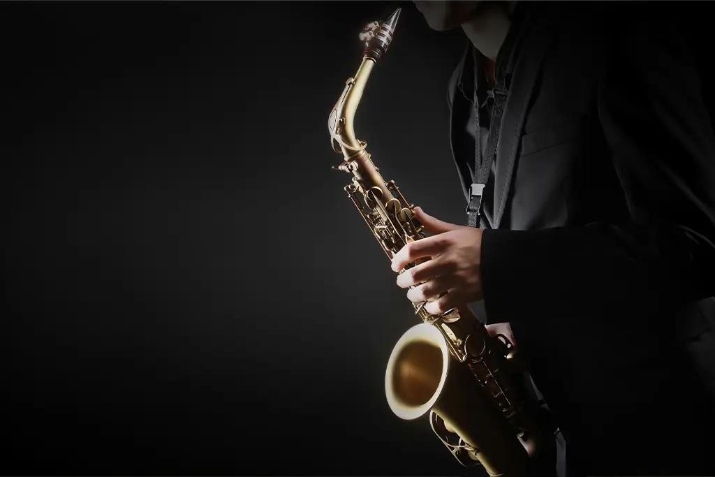 Man in suit playing saxophone