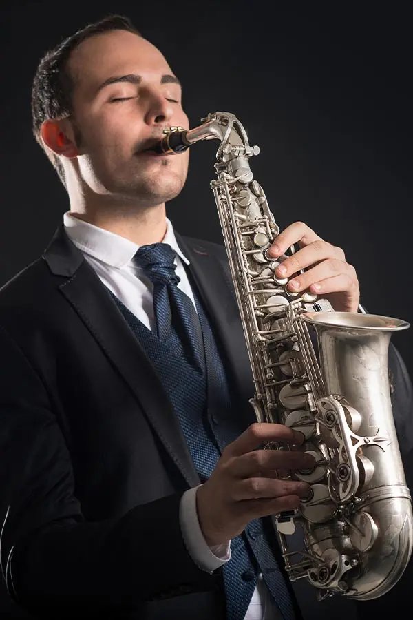 Man in suit playing saxophone