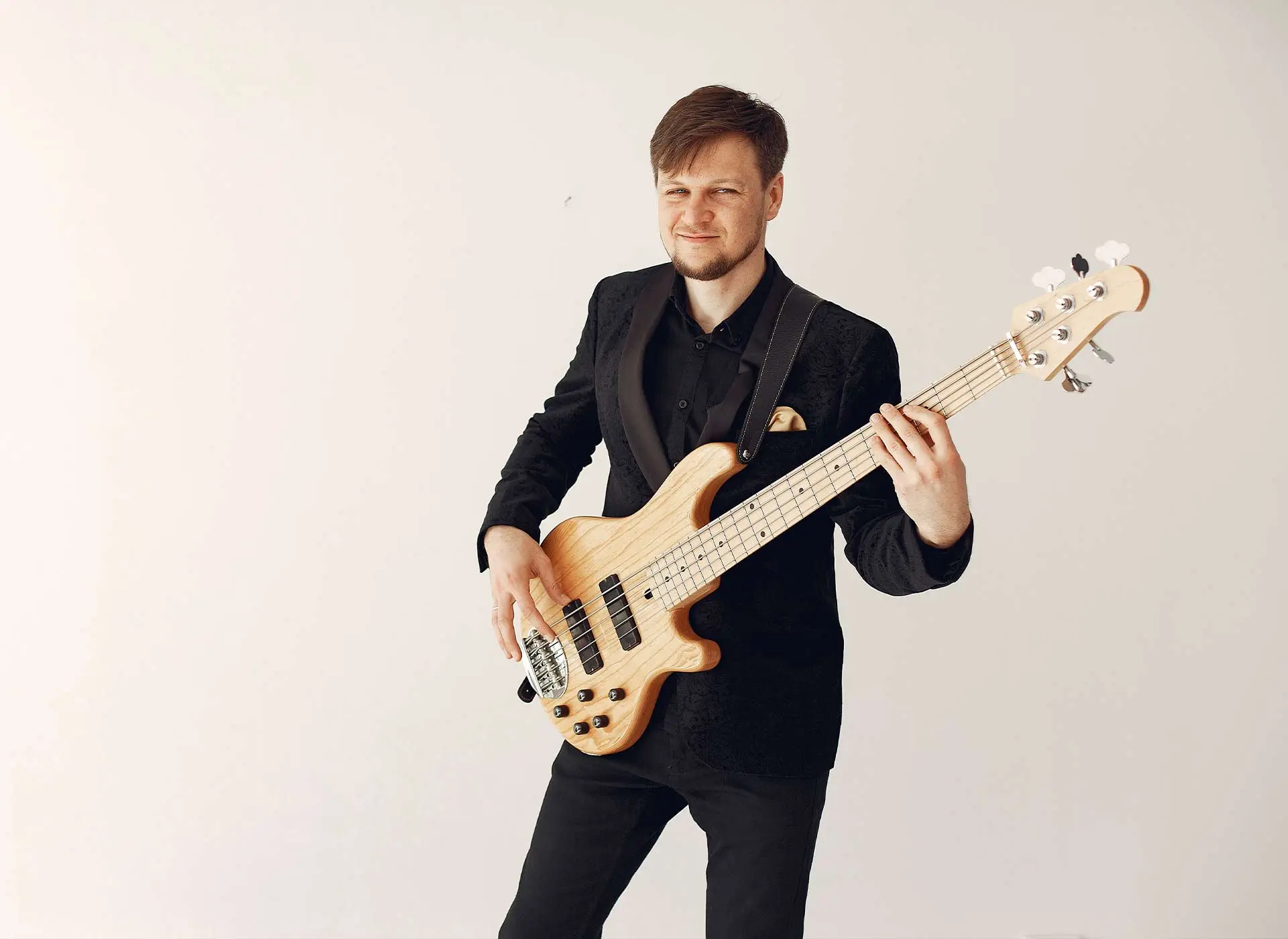 Man in suit with bass guitar