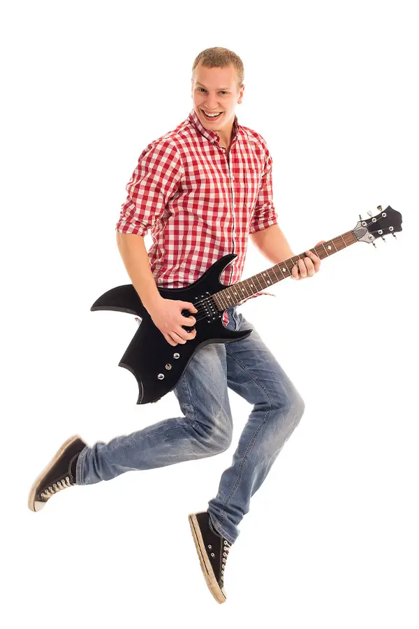 Man jumping while holding a black electric guitar