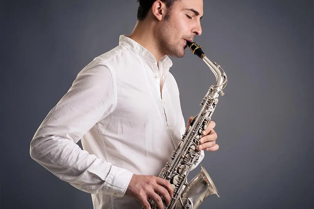 Man passionately playing the saxophone