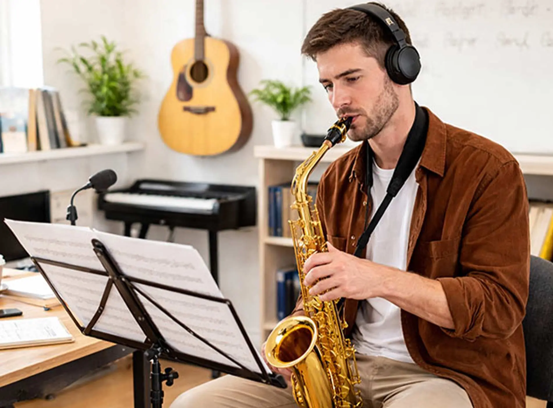 Man with headphone playing saxophone