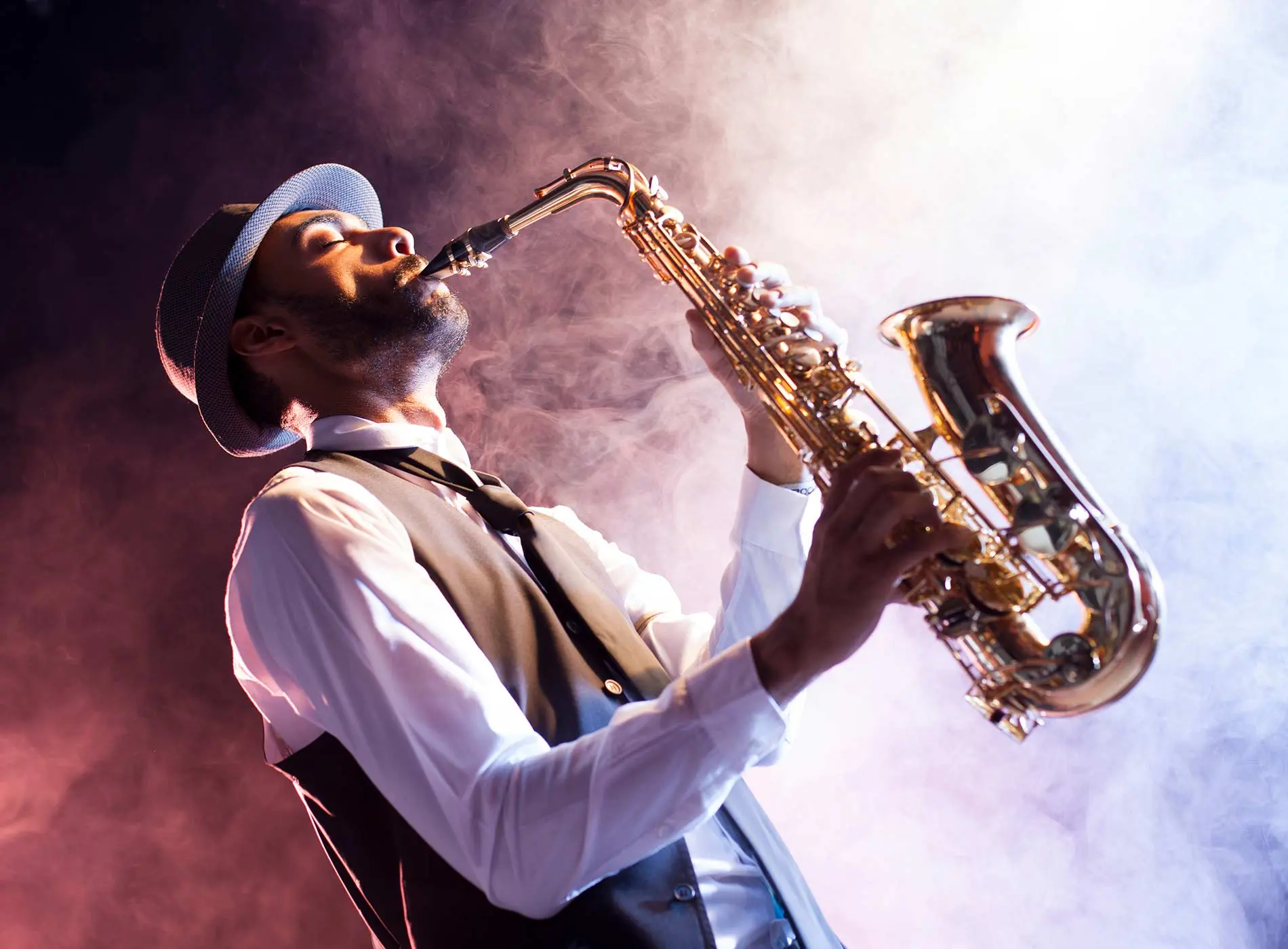 Black jazz musician playing saxophone