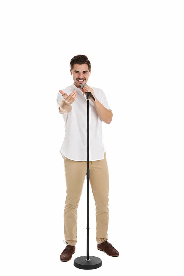 Man singing into a microphone on a stand