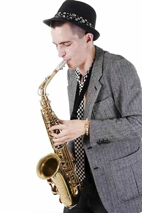 Man with hat playing saxophone