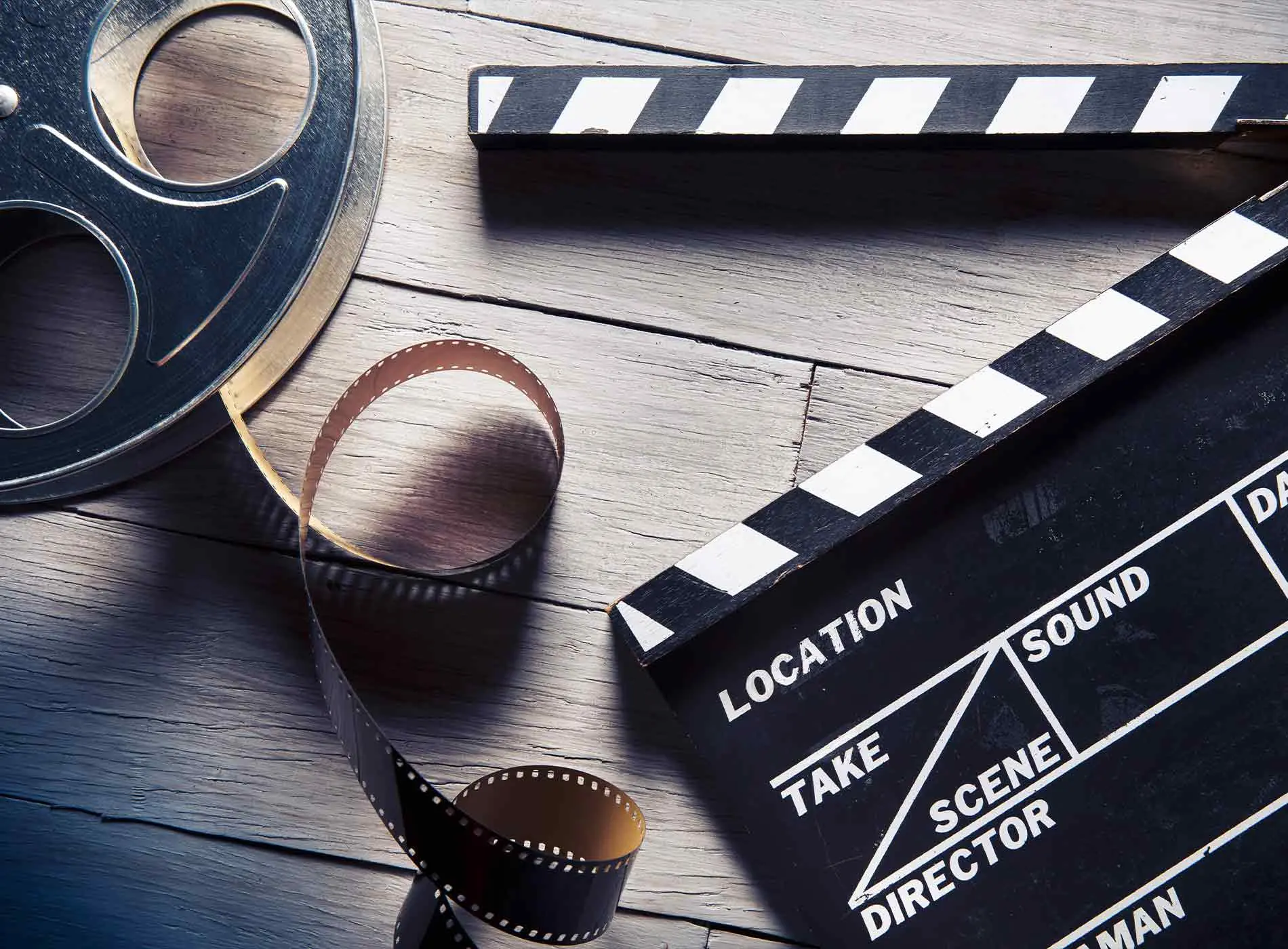 Movie clapper and film reel