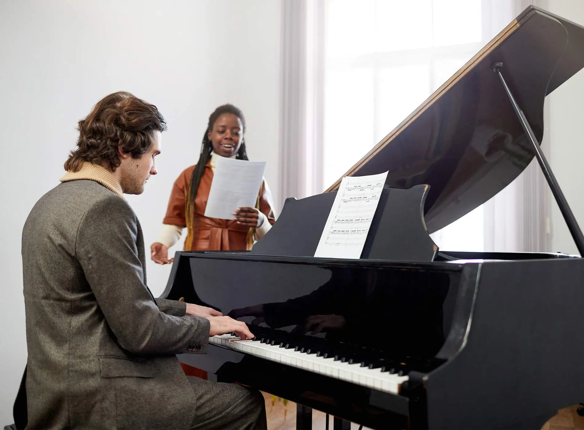 Music teacher and student having lesson