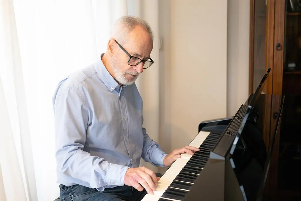 Old man playing the piano