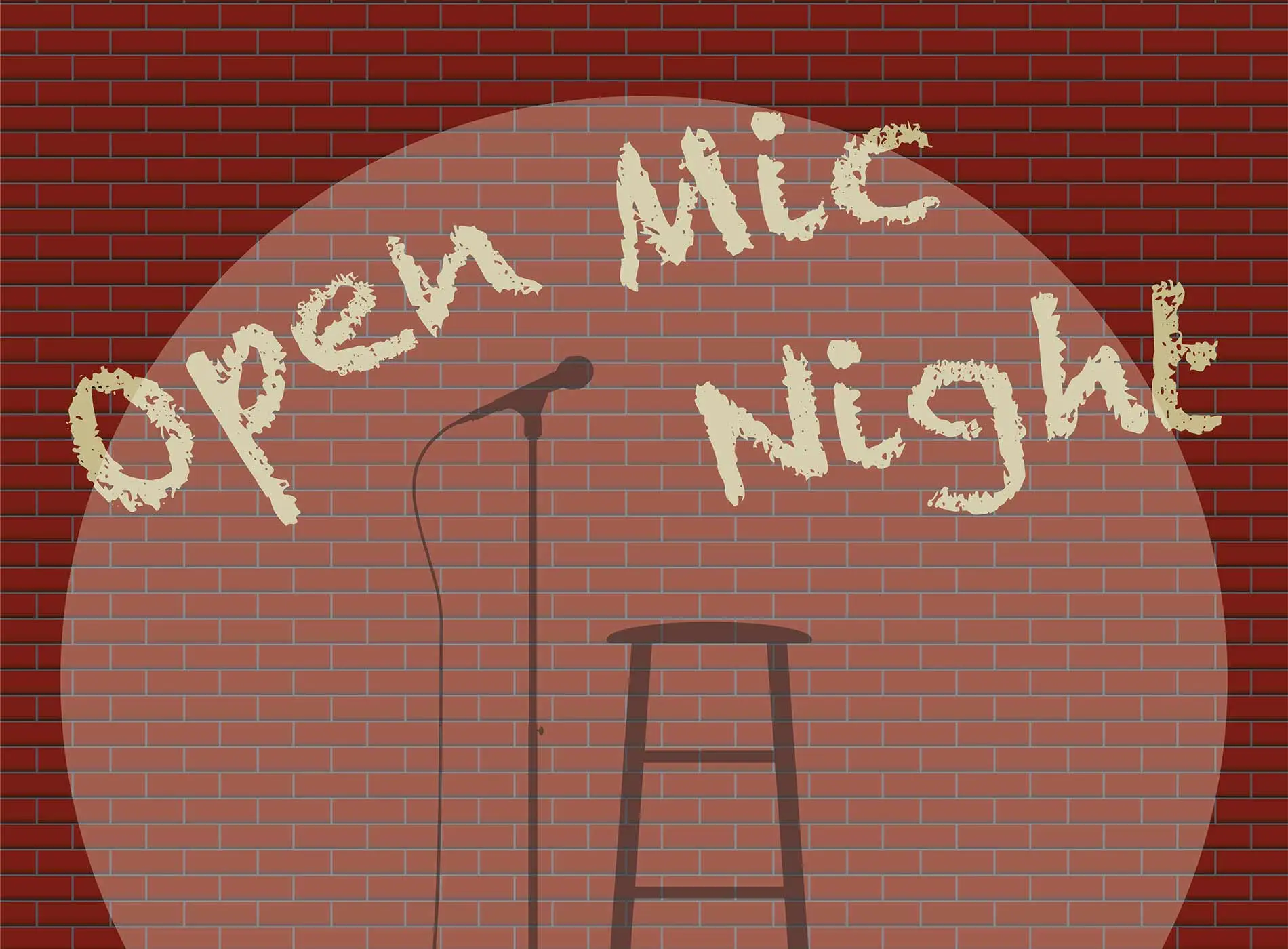 Microphone and chair on stage with text open mic night
