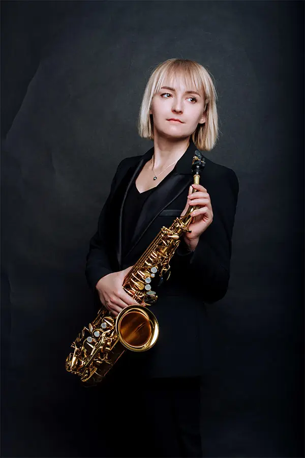 Professional musician holding a saxophone