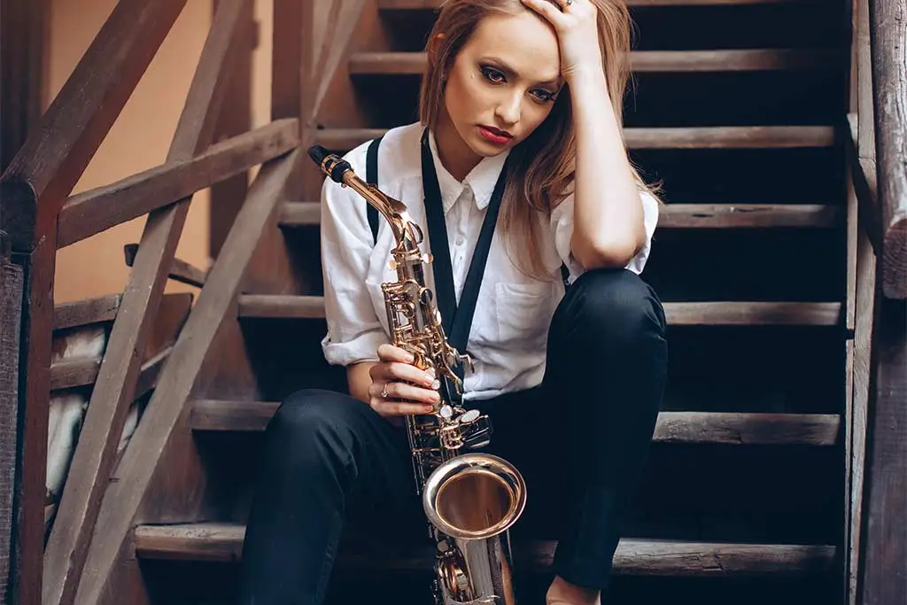 Sad female saxophonist