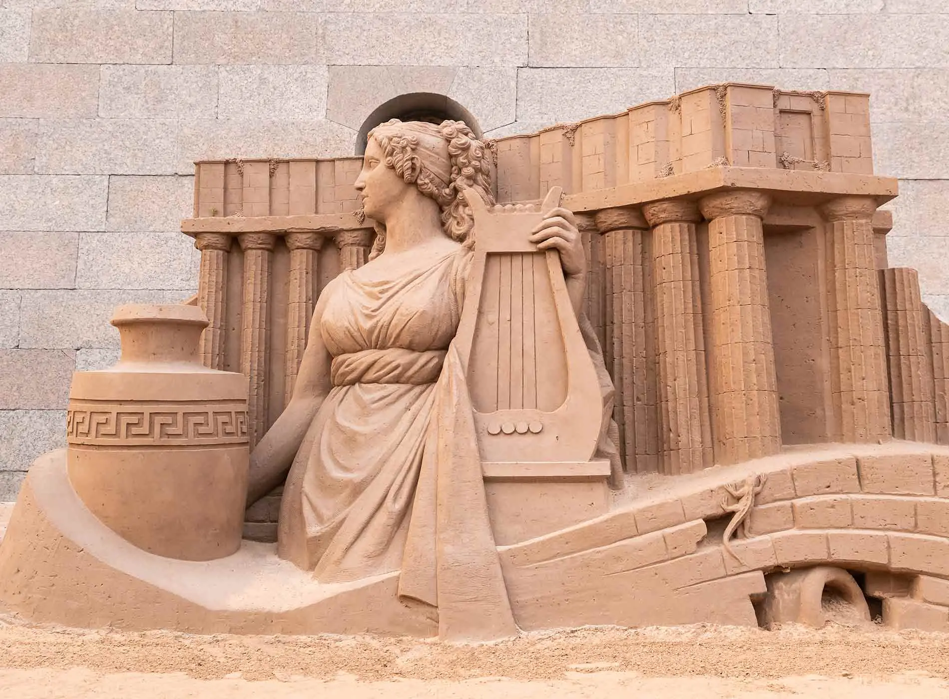 Sand sculpture of greek myths character with a lyre
