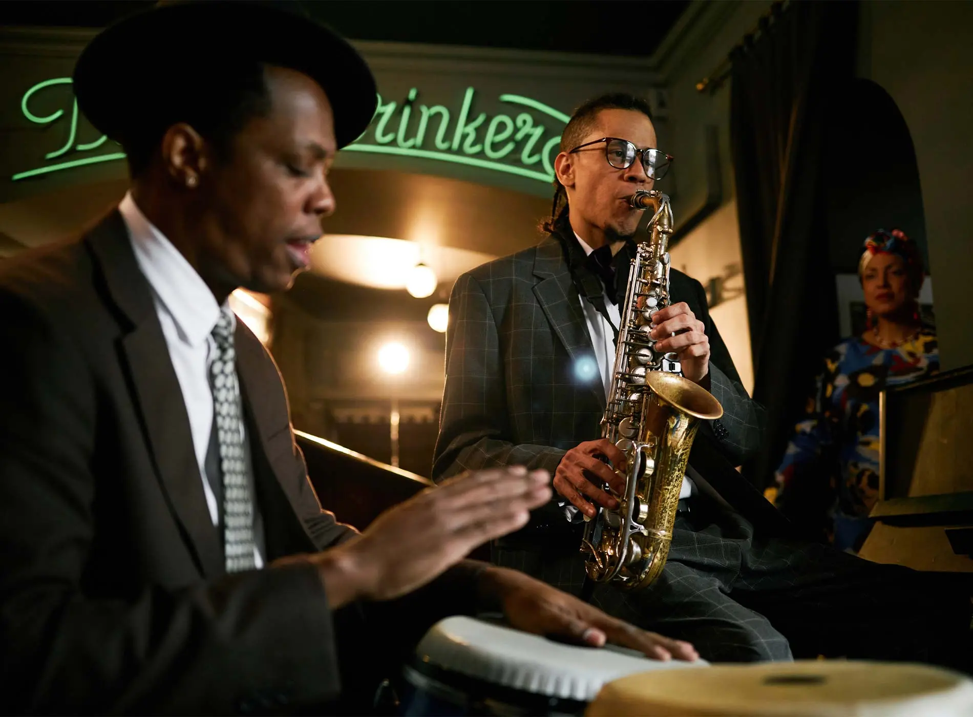 Saxophone and drummer playing together