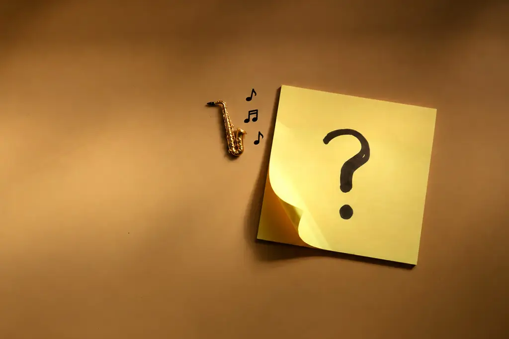 Small saxophone and musical notes beside a question mark