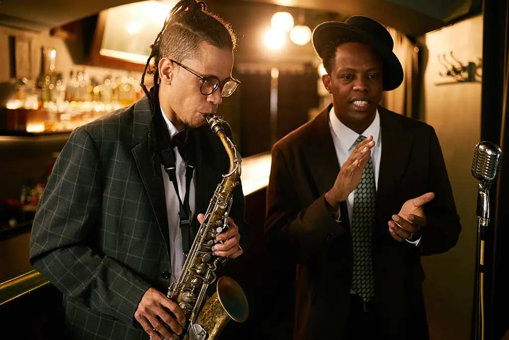 Saxophonist and singer performing in a bar