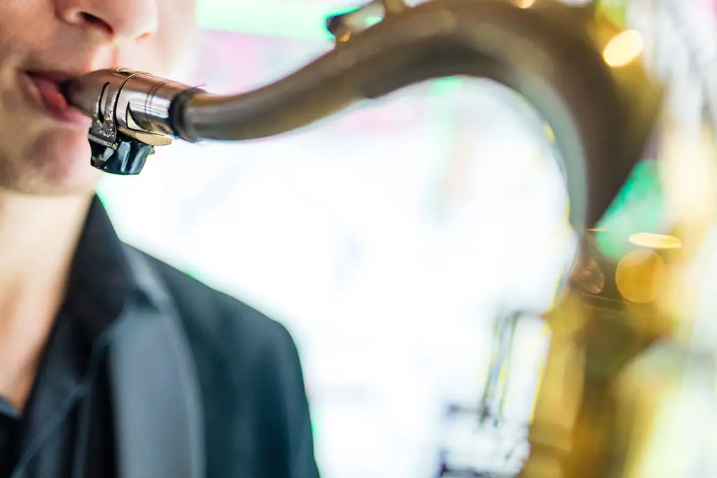 Close-up of a saxophonist playing a saxophone
