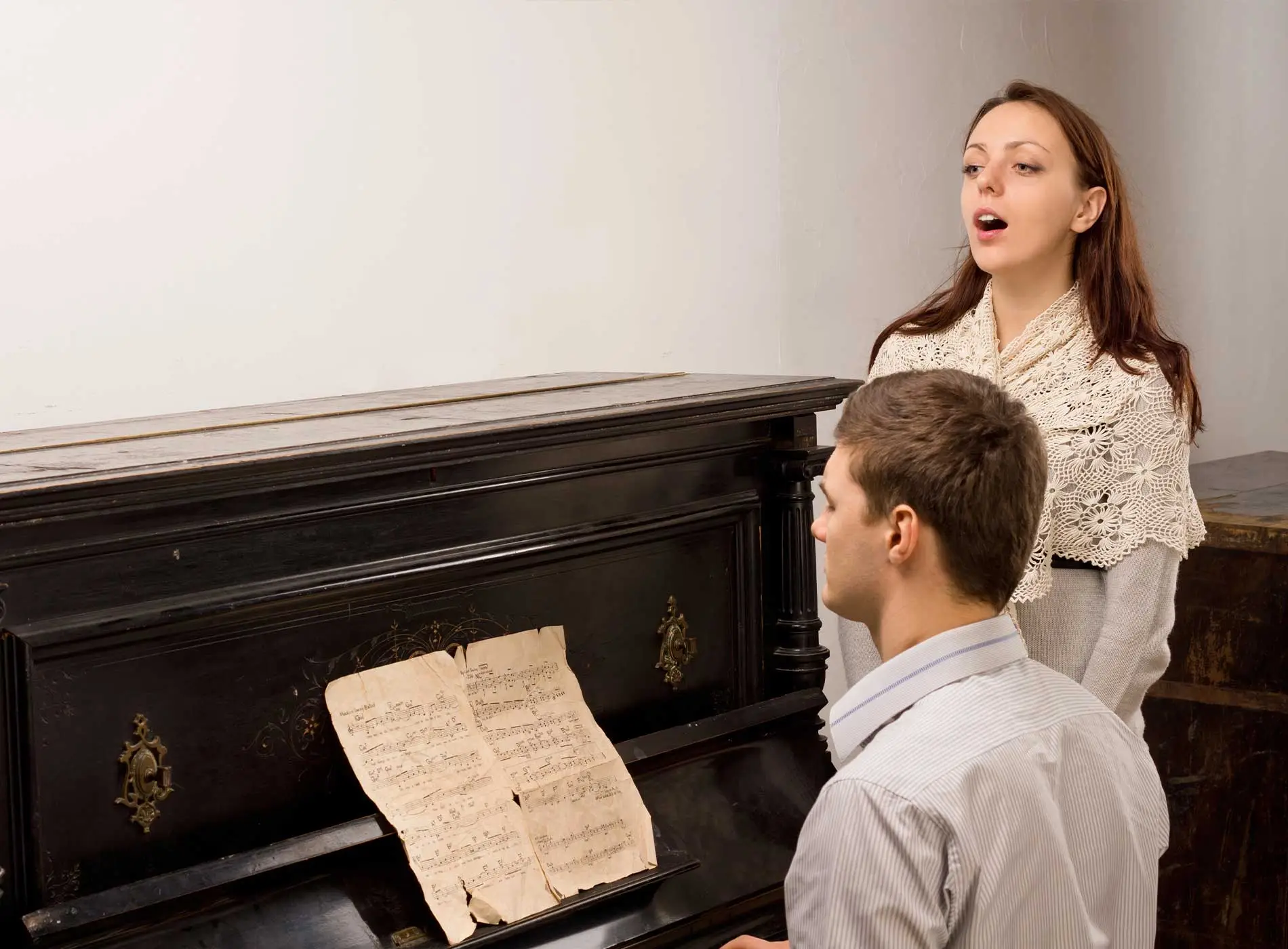 Singing teacher and student having lesson