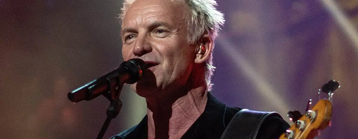 Sting singing and playing bass guitar