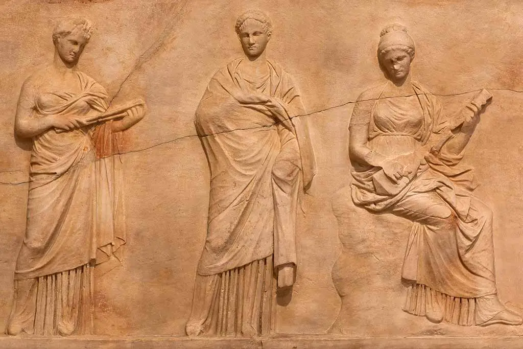 Stone relief of robed figures holding lyres