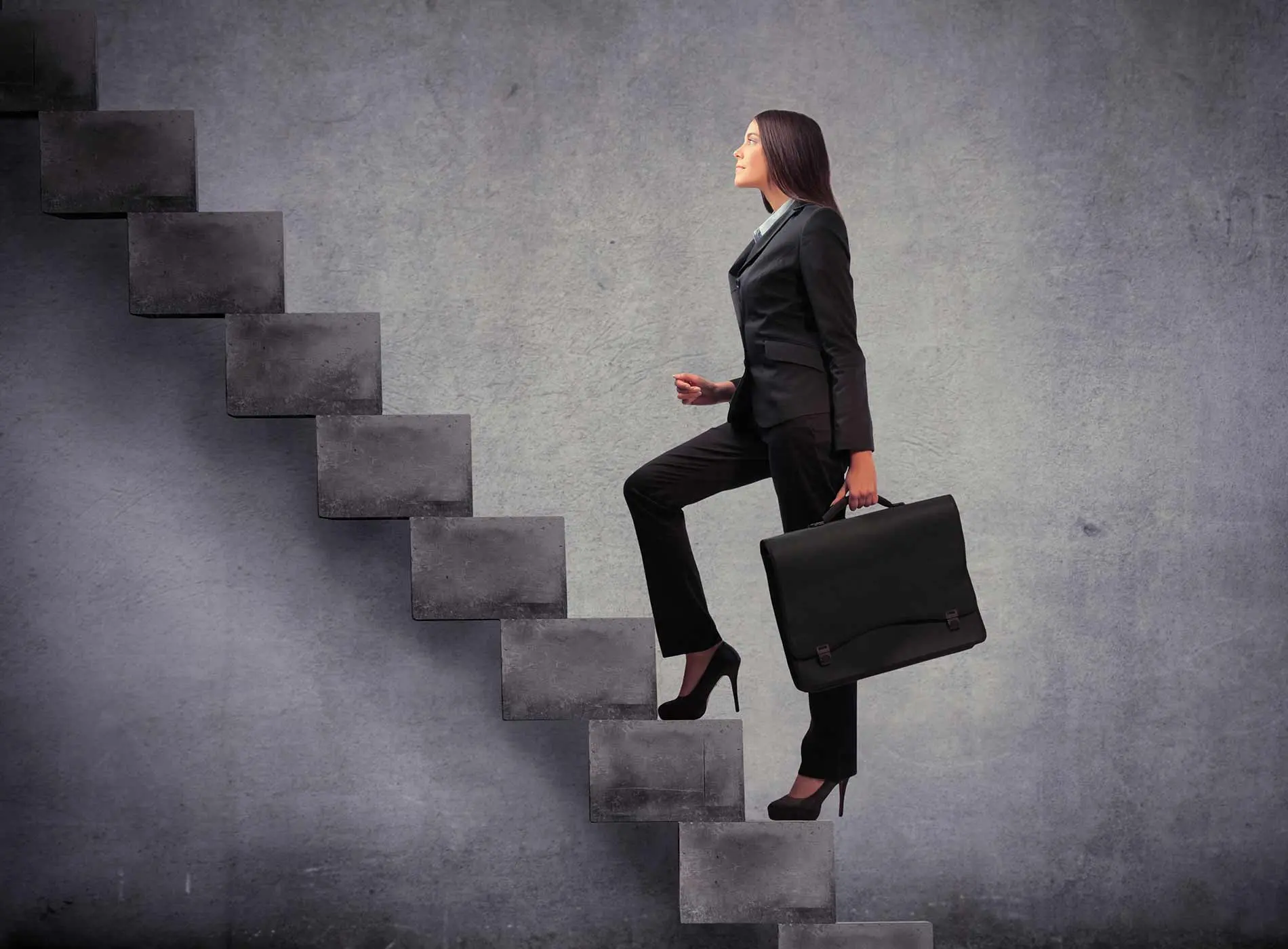 Lady with a lot of ambition climbing the stairs to success