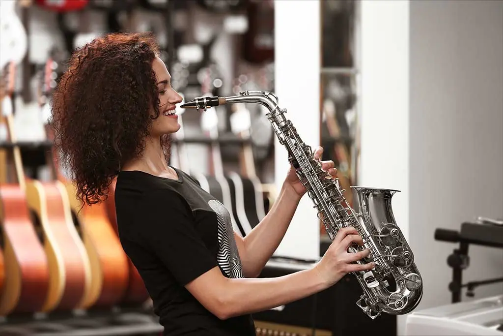 Woman holding saxophone