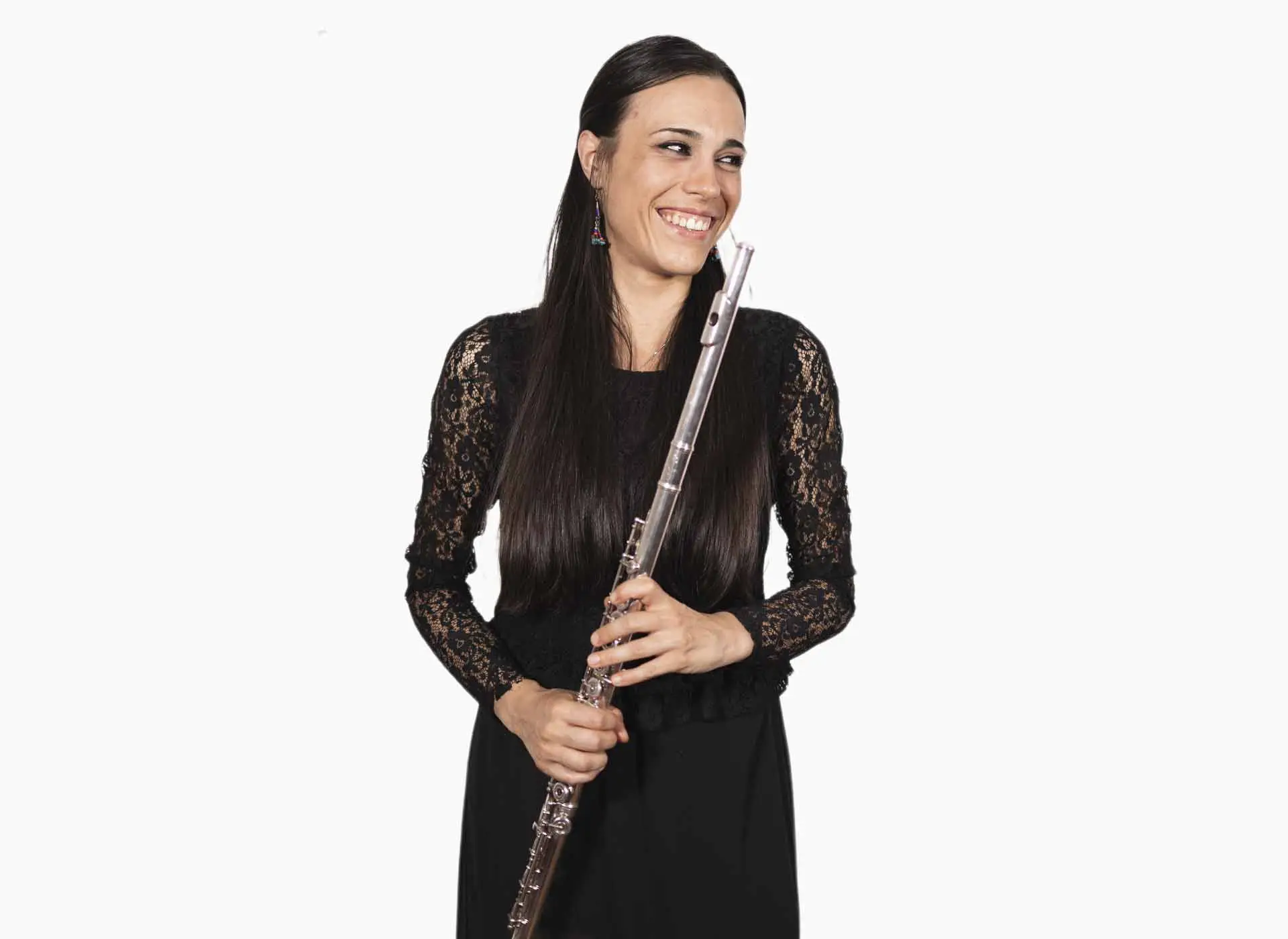 Smiling woman in a black dress holding a silver flute