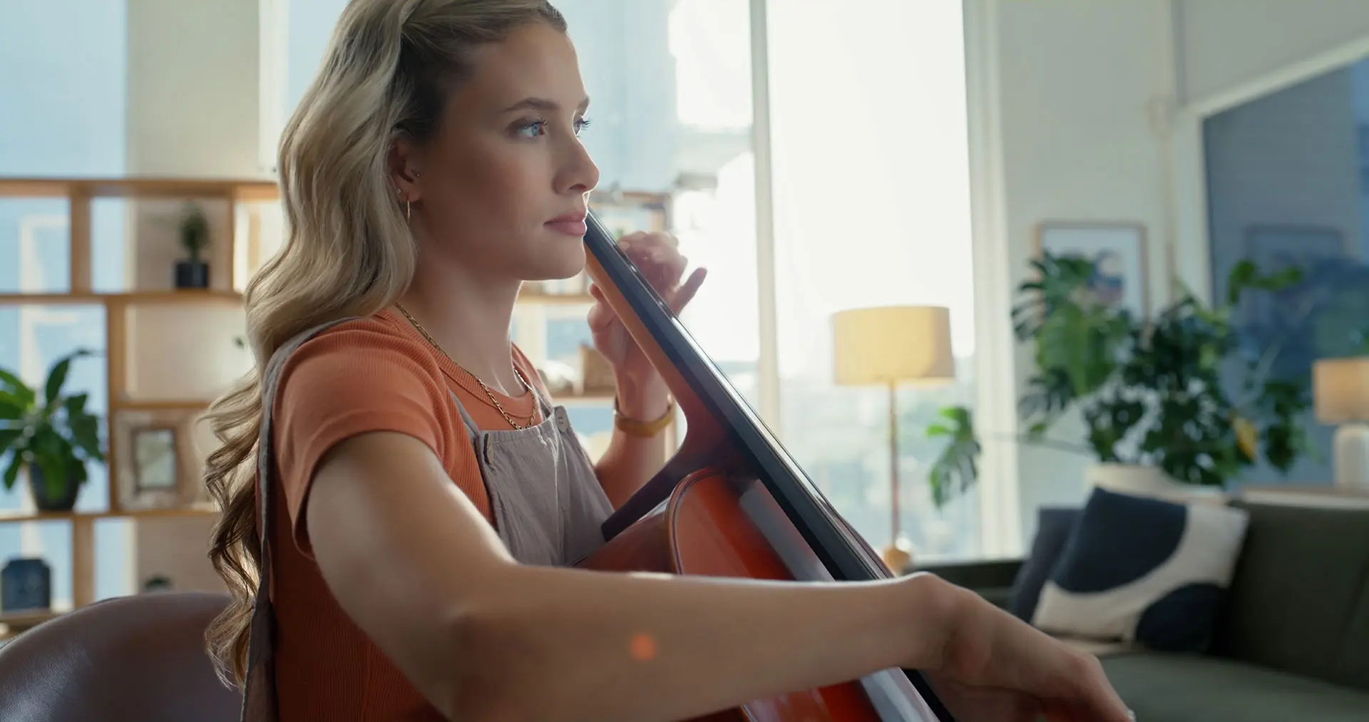 A woman practising the cello
