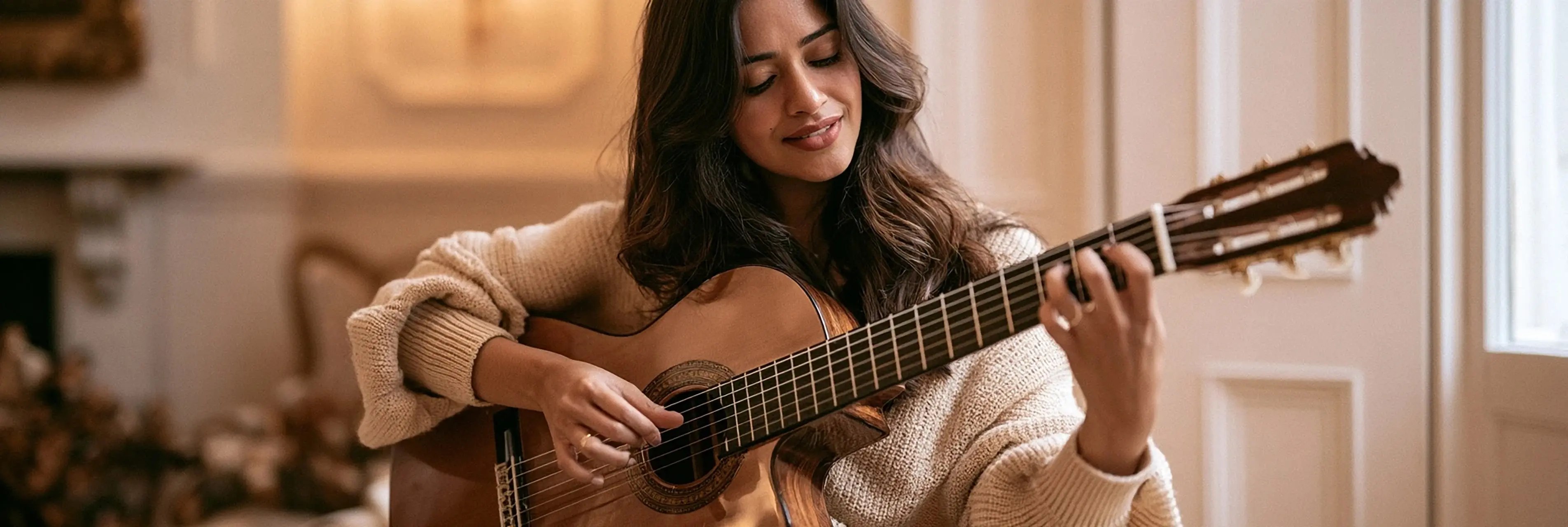 A woman playing a classical guitar