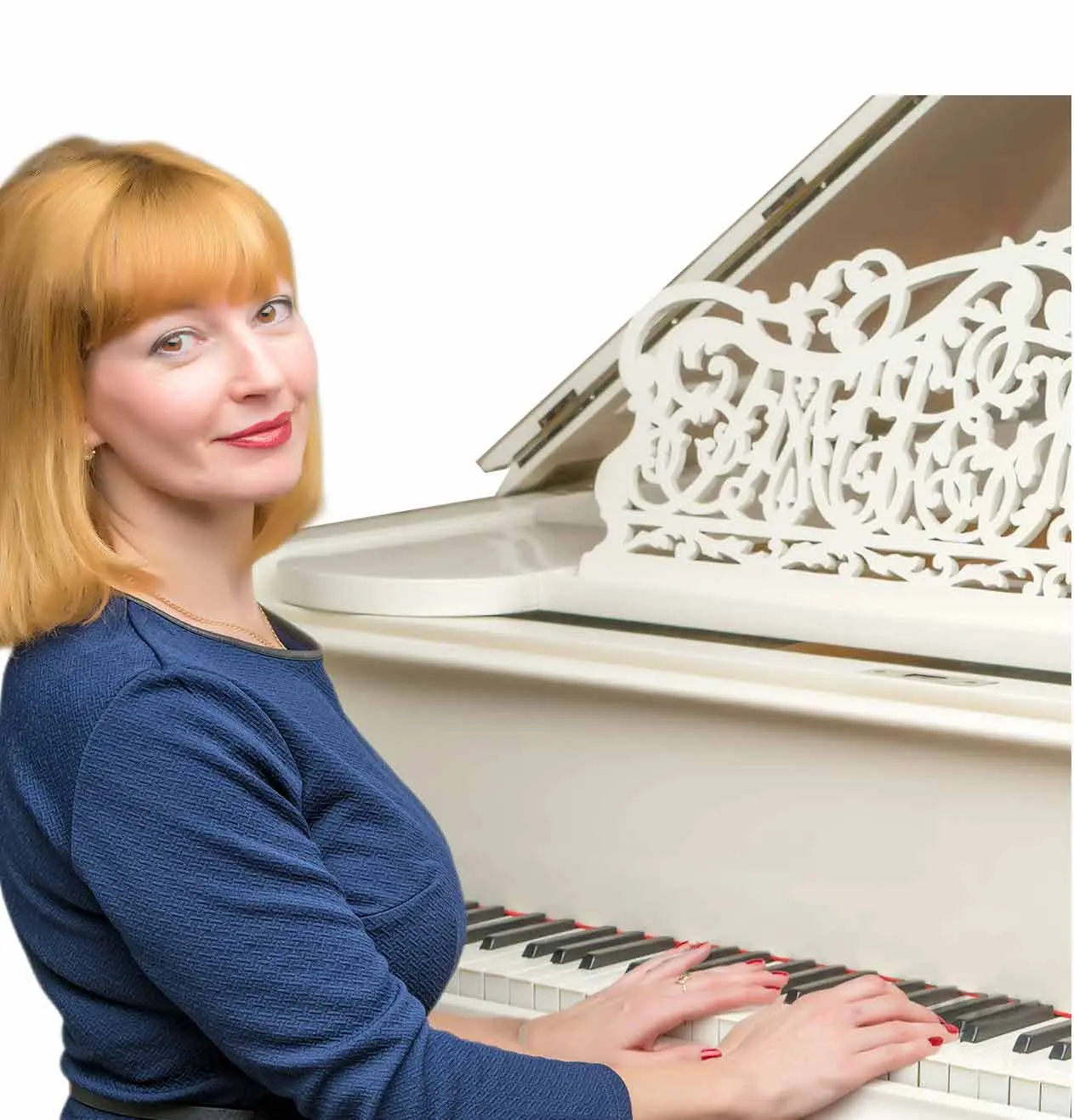 Woman in a blue top playing a white grand piano
