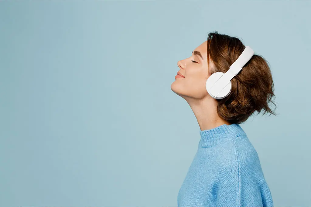 Woman wearing headphones listening to music