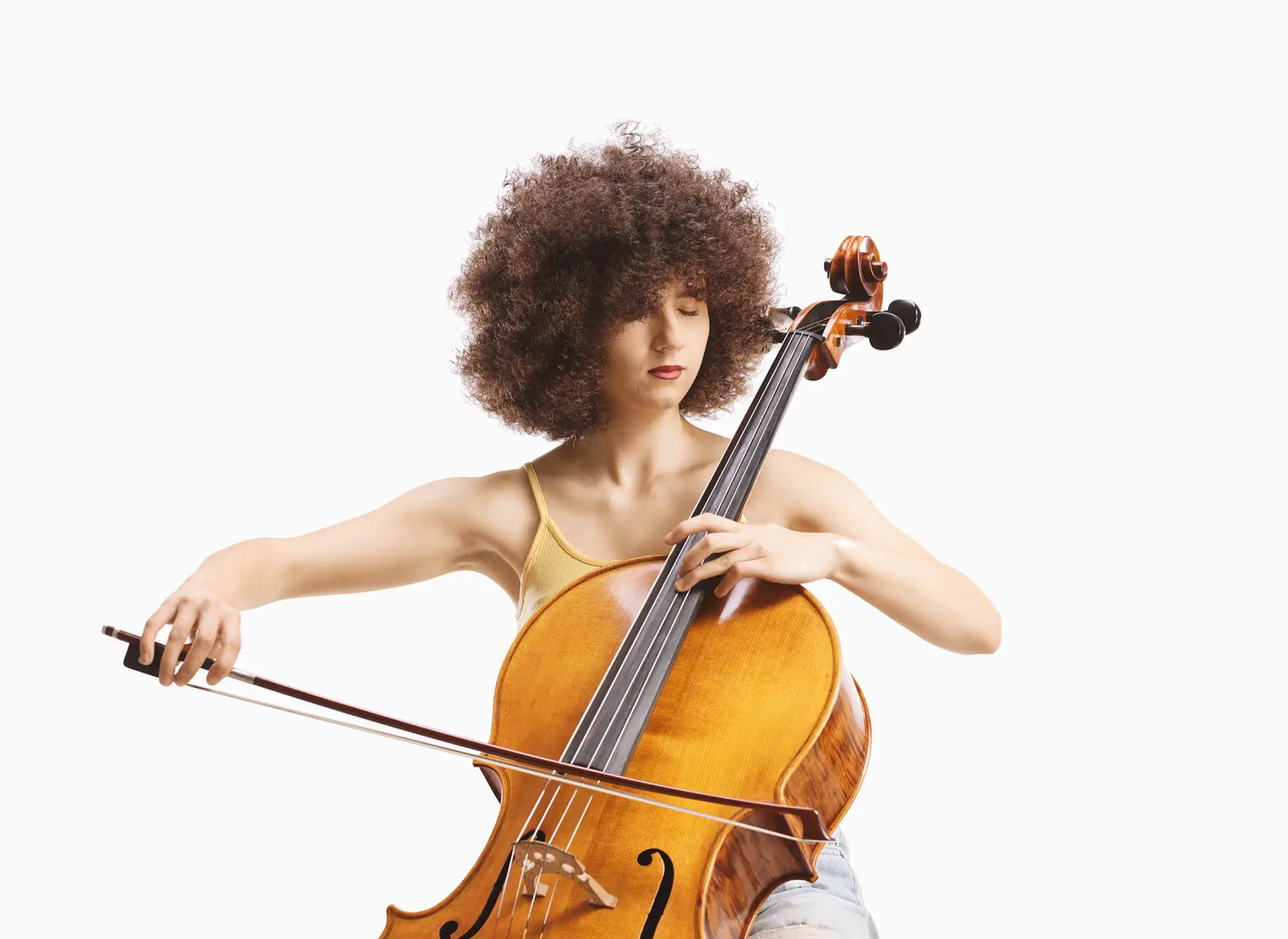 Woman in a yellow top playing a cello